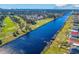 Aerial view of community featuring a canal, homes and golf course at 1131 East Isle Of Palms, Myrtle Beach, SC 29579