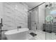 Spa-like bathroom featuring a soaking tub and a glass-enclosed shower at 1131 East Isle Of Palms, Myrtle Beach, SC 29579