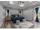 Spacious bedroom featuring a tray ceiling, wood-look floors and large windows at 1131 East Isle Of Palms, Myrtle Beach, SC 29579
