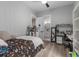 Bedroom featuring wood-look floors, ensuite bathroom, and decorated desk with chair and decor at 1131 East Isle Of Palms, Myrtle Beach, SC 29579