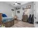 Bedroom features wood-look floors, a rustic wood dresser, and a neutral color scheme at 1131 East Isle Of Palms, Myrtle Beach, SC 29579