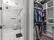 Walk-in closet and view of bathroom with glass shower at 1131 East Isle Of Palms, Myrtle Beach, SC 29579
