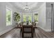Elegant dining room with a large table, chandelier, and plenty of natural light at 1131 East Isle Of Palms, Myrtle Beach, SC 29579
