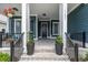 Welcoming front porch with classic columns and decor, offering a cozy outdoor space at 1131 East Isle Of Palms, Myrtle Beach, SC 29579