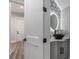 Modern half-bath featuring unique wallpaper and a vessel sink with granite countertops at 1131 East Isle Of Palms, Myrtle Beach, SC 29579