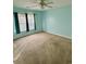 Bright bedroom with neutral carpet, and a large window, creating a cozy and inviting atmosphere at 118 Retreat Pl., Little River, SC 29566