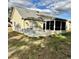 Backyard showcasing the patio, screened-in porch, and neutral siding at 118 Retreat Pl., Little River, SC 29566
