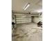 Spacious garage with ample room for parking and storage, featuring a sturdy concrete floor at 118 Retreat Pl., Little River, SC 29566