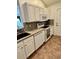 Clean kitchen featuring white appliances and ample storage space with speckled countertops and tile flooring at 118 Retreat Pl., Little River, SC 29566