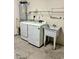 Well-equipped laundry area with modern washer, dryer, and utility sink for efficient chores at 118 Retreat Pl., Little River, SC 29566