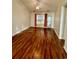 Inviting living room featuring hardwood floors, a ceiling fan, and a sliding glass door to the outside at 118 Retreat Pl., Little River, SC 29566