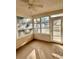 Enclosed sunroom with ample natural light, ceiling fan and views of the backyard at 118 Retreat Pl., Little River, SC 29566