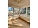 This enclosed sunroom allows ample natural light and has views of the backyard at 118 Retreat Pl., Little River, SC 29566