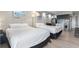 Bright bedroom featuring two beds and a modern kitchenette with stainless steel appliances at 1207 S Ocean Blvd. # 20109, Myrtle Beach, SC 29577