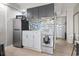 Efficient kitchenette with modern appliances, stylish cabinetry and mosaic backsplash at 1207 S Ocean Blvd. # 20109, Myrtle Beach, SC 29577