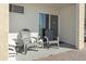 A patio features chairs and a sliding door to the inside at 1207 S Ocean Blvd. # 20109, Myrtle Beach, SC 29577