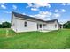 Spacious backyard with lush green grass and a view of the home's exterior at 142 Temple Dr., Aynor, SC 29511