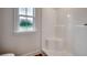 Bathroom featuring a modern shower with window providing natural light at 142 Temple Dr., Aynor, SC 29511