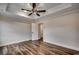 Bright bedroom features modern flooring and a ceiling fan, providing a comfortable and stylish space at 142 Temple Dr., Aynor, SC 29511