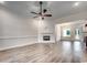 Spacious living room with a modern fireplace, abundant natural light, and open floor plan at 142 Temple Dr., Aynor, SC 29511