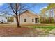 An angled view of the home showing the yard space and the exterior siding at 146 Temple Dr., Aynor, SC 29511