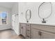 Well-lit bathroom with double vanity, modern fixtures, and stylish lighting, creating a luxurious feel at 146 Temple Dr., Aynor, SC 29511