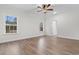 Serene bedroom with bright windows, modern flooring, and a doorway to another room at 146 Temple Dr., Aynor, SC 29511