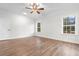 Bright, spacious bedroom featuring two windows, a ceiling fan, and neutral decor at 146 Temple Dr., Aynor, SC 29511