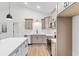 Bright kitchen showcasing stainless steel appliances, quartz counters and island, plus eat-in kitchen at 146 Temple Dr., Aynor, SC 29511