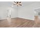 Bright, neutral living space showcasing luxury vinyl plank flooring and a contemporary ceiling fan at 146 Temple Dr., Aynor, SC 29511