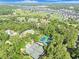 Aerial view of property showing trees, waterways and tennis courts at 1551 Spinnaker Dr. # 5913, North Myrtle Beach, SC 29582