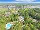 Aerial view of the property, tennis courts, pool, and lush landscaping at 1551 Spinnaker Dr. # 5913, North Myrtle Beach, SC 29582