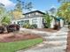 Attractive amenity center features green trim, well-maintained landscaping, and a welcoming walkway at 1551 Spinnaker Dr. # 5913, North Myrtle Beach, SC 29582