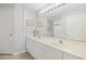Bright bathroom with double sinks and a large mirror at 1551 Spinnaker Dr. # 5913, North Myrtle Beach, SC 29582