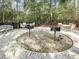 Outdoor grill area with multiple charcoal grills and seating surrounded by mature trees at 1551 Spinnaker Dr. # 5913, North Myrtle Beach, SC 29582