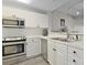 Modern kitchen featuring stainless steel appliances, white cabinetry, and ample counter space at 1551 Spinnaker Dr. # 5913, North Myrtle Beach, SC 29582