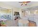 Open-concept living area featuring a sliding glass door to the balcony, hardwood floors, and stylish decor at 1551 Spinnaker Dr. # 5913, North Myrtle Beach, SC 29582