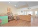 Spacious living room with hardwood floors, track lighting, and a comfortable sofa and chair at 1551 Spinnaker Dr. # 5913, North Myrtle Beach, SC 29582