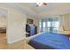 Cozy main bedroom featuring a ceiling fan, tv, and sliding glass doors at 1551 Spinnaker Dr. # 5913, North Myrtle Beach, SC 29582