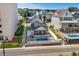 A clear aerial perspective showcasing the backyard pool, outdoor grill, and the quaint neighborhood setting at 1616 S Ocean Blvd., North Myrtle Beach, SC 29582