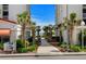 Scenic walkway framed by palm trees offering convenient access to the pristine beach and ocean at 1616 S Ocean Blvd., North Myrtle Beach, SC 29582