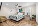 Comfortable bedroom featuring a queen bed, ceiling fan, and artwork creating a relaxing and stylish retreat at 1616 S Ocean Blvd., North Myrtle Beach, SC 29582