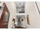 Elegant two-story foyer with modern lighting, staircase, and decorative artwork at 1616 S Ocean Blvd., North Myrtle Beach, SC 29582