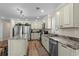 Spacious kitchen featuring stainless steel appliances, granite countertops, and custom cabinetry at 1616 S Ocean Blvd., North Myrtle Beach, SC 29582