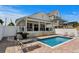 Inviting pool with lounge chairs and grill, perfect for outdoor relaxation and entertaining at 1616 S Ocean Blvd., North Myrtle Beach, SC 29582