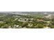 Overhead perspective of homes surrounded by lush greenery and a bay, showcasing the peaceful setting at 175 Summer Wind Loop, Murrells Inlet, SC 29576
