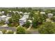 Aerial view of a residential neighborhood featuring well-manicured lawns, mature trees, and a charming street at 175 Summer Wind Loop, Murrells Inlet, SC 29576