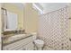 Well-lit bathroom features a granite countertop vanity, a toilet, and a shower with curtains at 175 Summer Wind Loop, Murrells Inlet, SC 29576