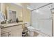 Well-lit bathroom features a granite countertop vanity, a toilet, and a shower with glass doors at 175 Summer Wind Loop, Murrells Inlet, SC 29576