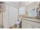Cozy bathroom with a vanity, toilet, tile floors, and a shower with a patterned shower curtain at 175 Summer Wind Loop, Murrells Inlet, SC 29576